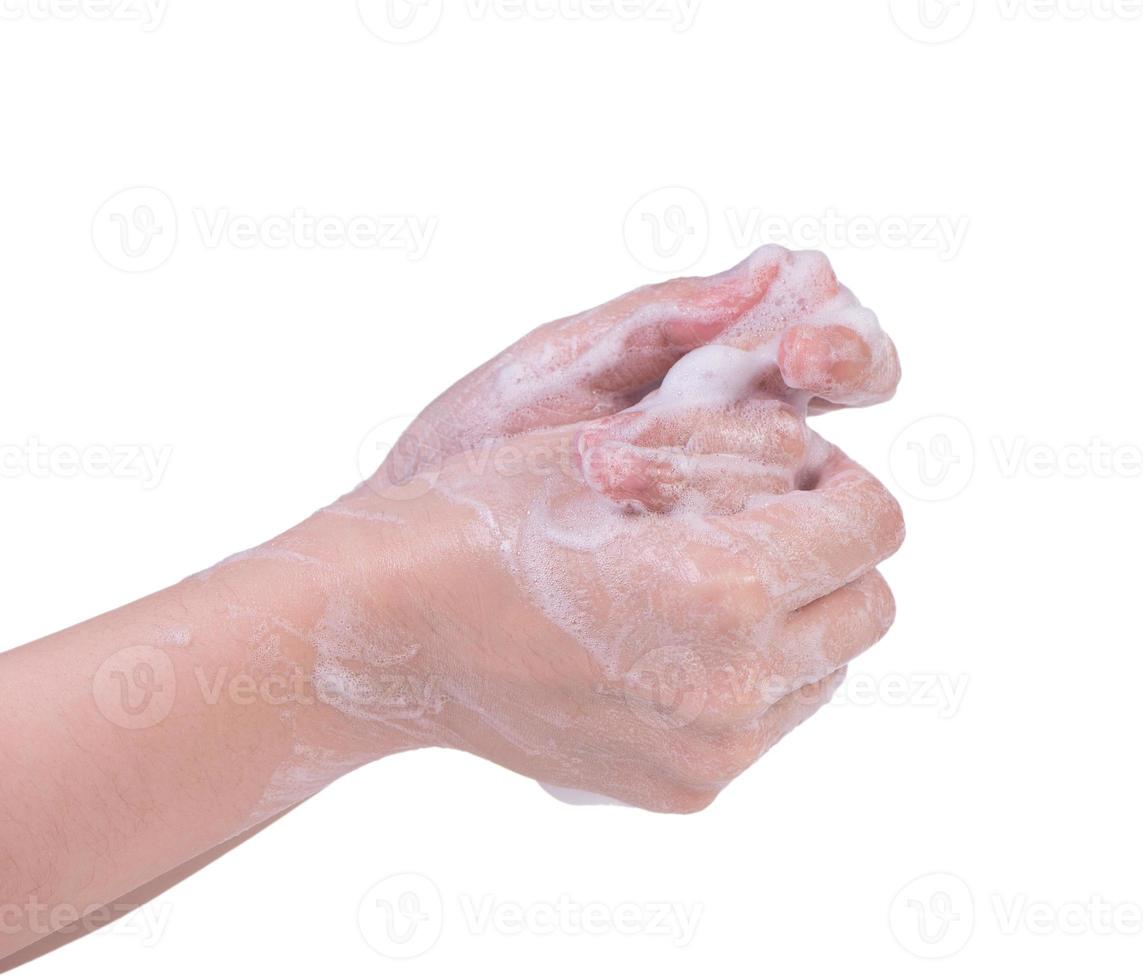 Washing hands isolated on white background. Asian young woman using liquid soap to wash hands, concept of protecting pandemic coronavirus, close up. photo