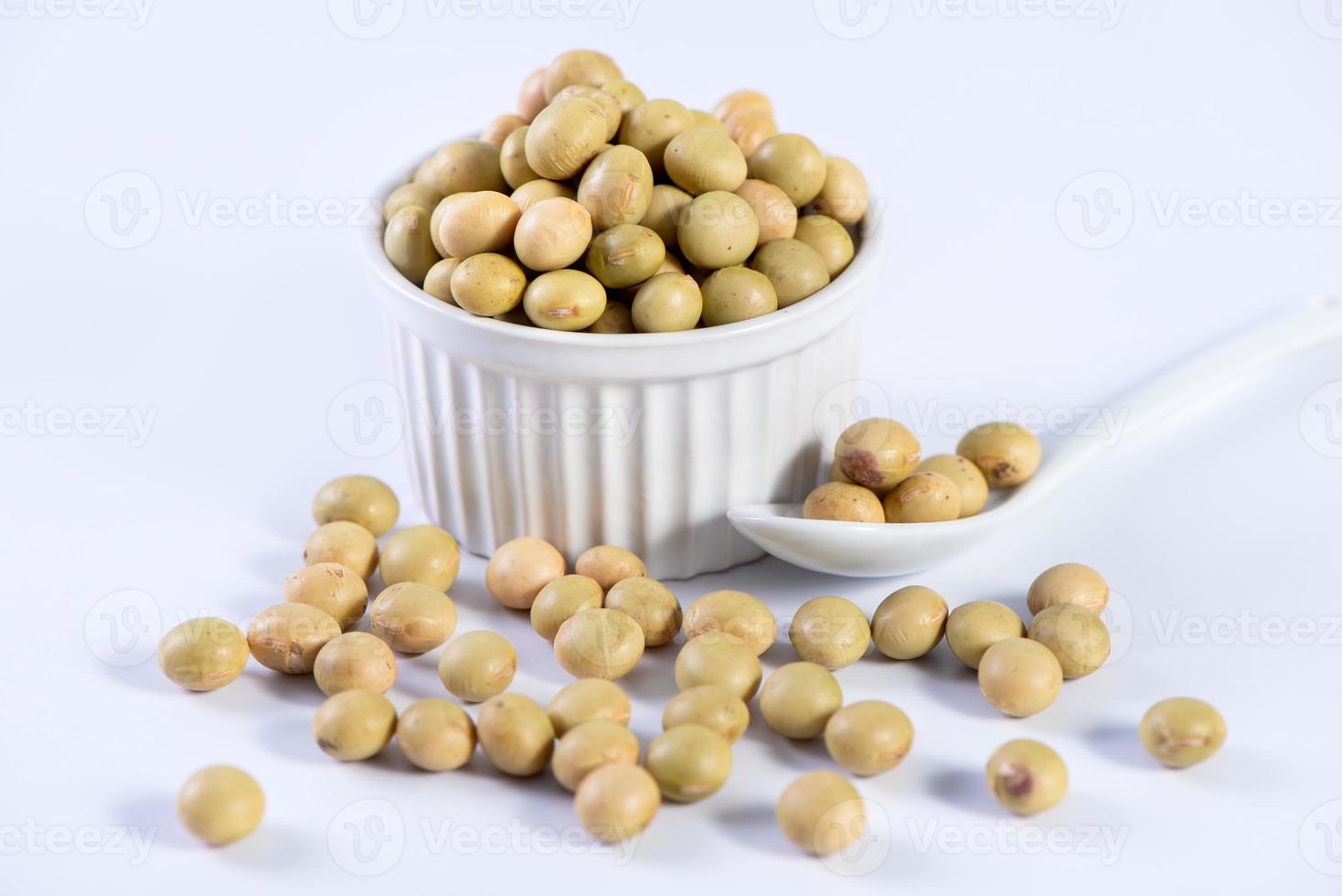 Yellow-green Taiwanese organic non-GMO soybeans, soy beans in a container isolated on white backgorund, close up, clipping path. photo