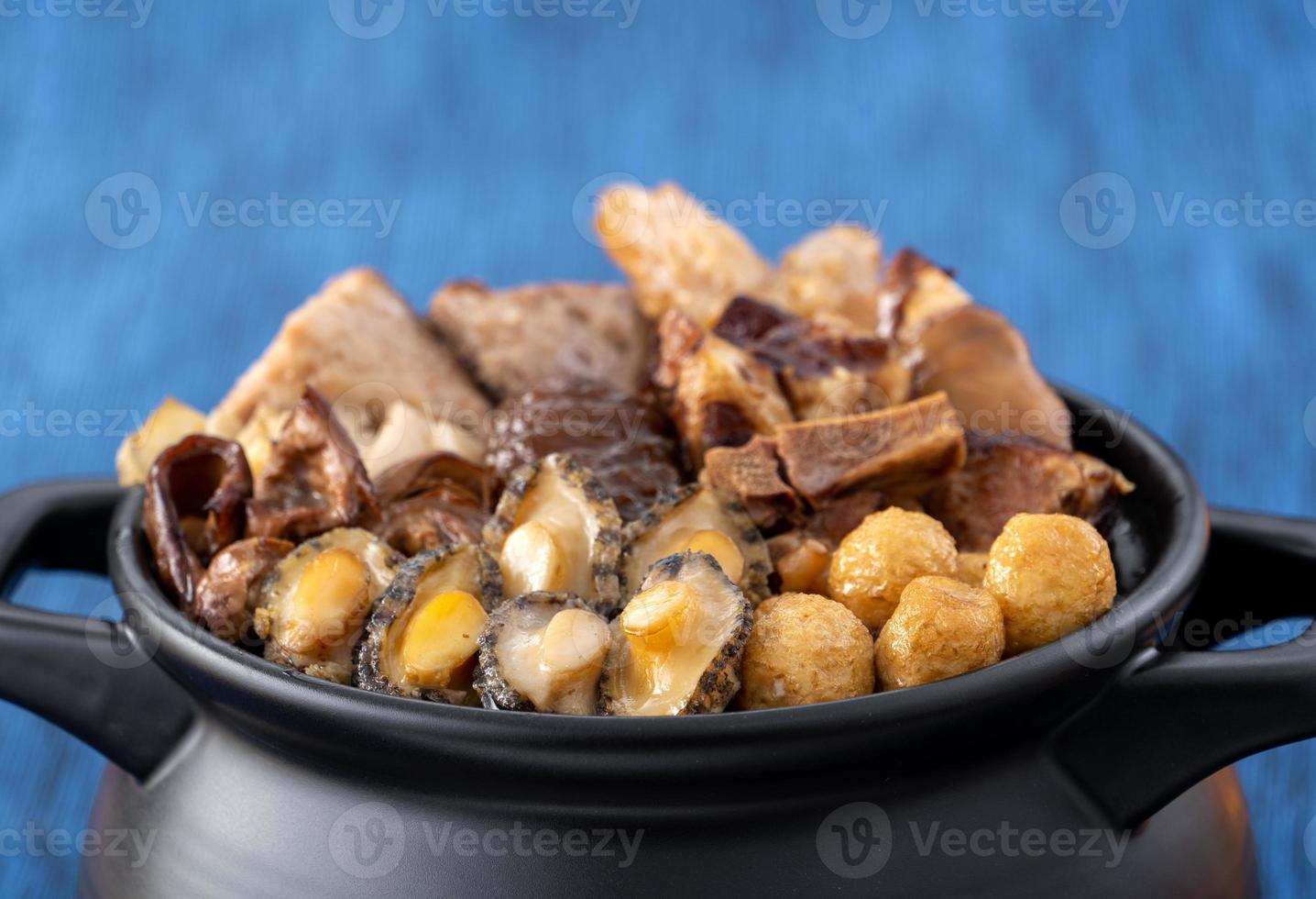 Traditional food of Chinese lunar new year, Buddha jumps over the wall, Chinese Soup Casserole dish, Buddha's Temptation, named Fo Tiao Qiang, close up. photo