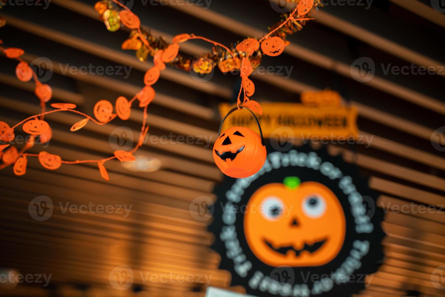 Festive Halloween cartoon decoration hanging on the ceiling of room interior, close up. photo