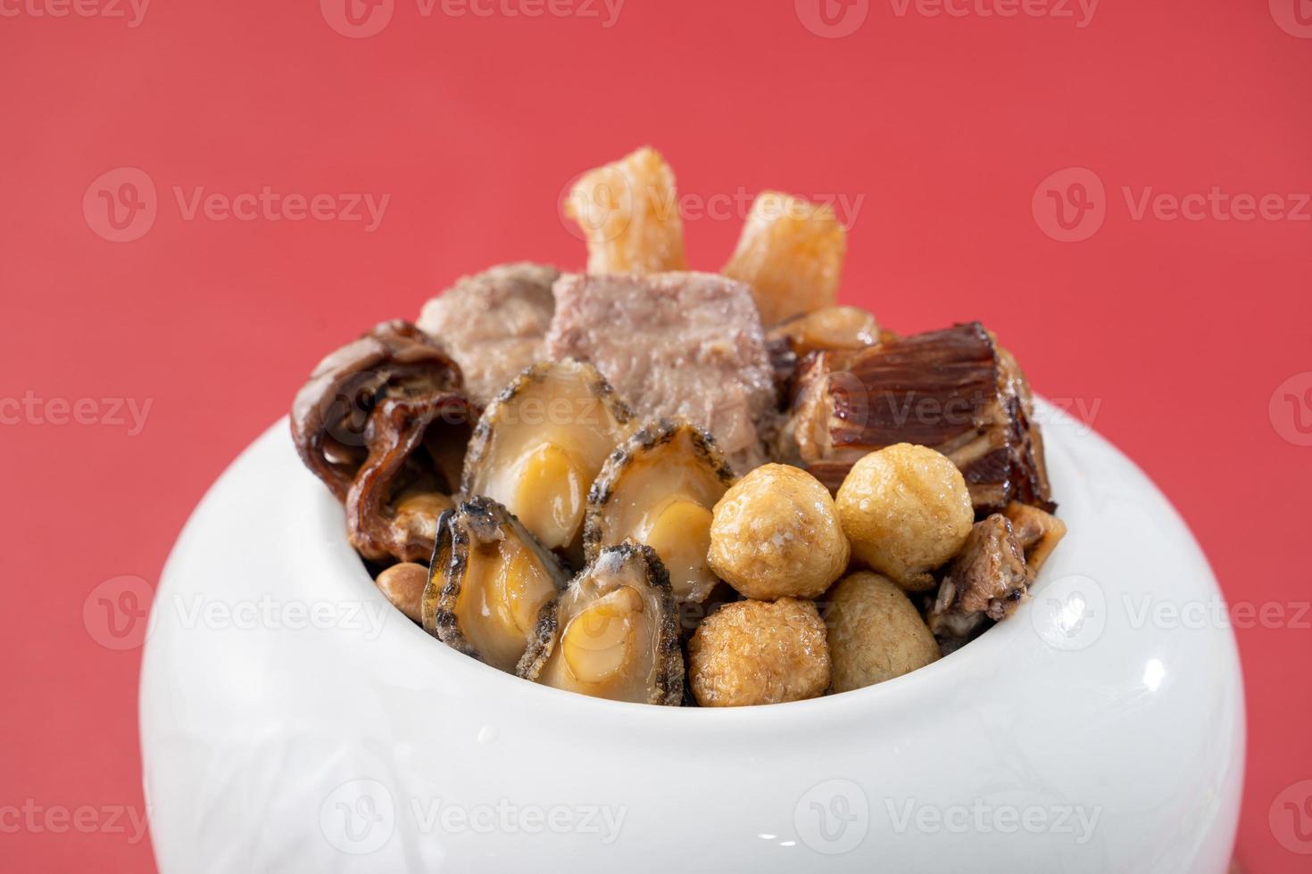 Traditional food of Chinese lunar new year, Buddha jumps over the wall, Chinese Soup Casserole dish, Buddha's Temptation, named Fo Tiao Qiang, close up. photo
