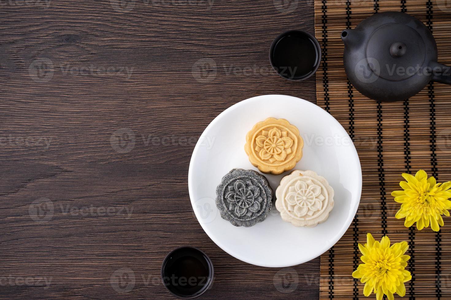 Colorful beautiful moon cake, mung bean cake, Champion Scholar Pastry cake for Mid-Autumn festival traditional gourmet dessert snack, top view, flat lay. photo