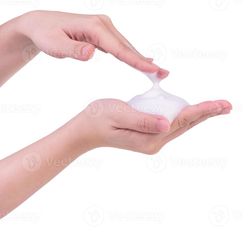 Washing hands isolated on white background. Asian young woman using liquid soap to wash hands, concept of protecting pandemic coronavirus, close up. photo