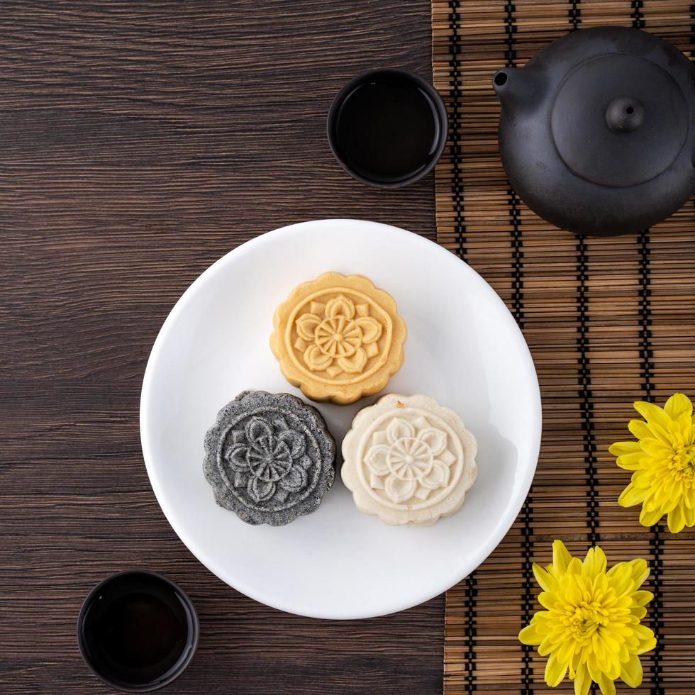 Colorful beautiful moon cake, mung bean cake, Champion Scholar Pastry cake for Mid-Autumn festival traditional gourmet dessert snack, top view, flat lay. photo