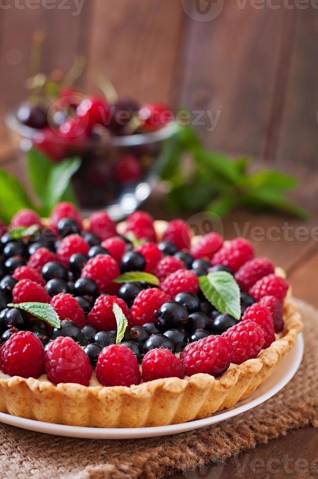 Tart with berries and custard photo