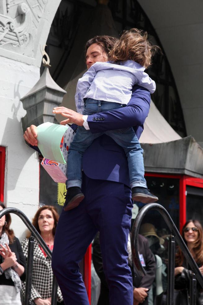 LOS ANGELES, APR 2 - Orlando Bloom, Flynn Bloom at the Orlando Bloom Hollywood Walk of Fame Star Ceremony at TCL Chinese Theater on April 2, 2014 in Los Angeles, CA photo