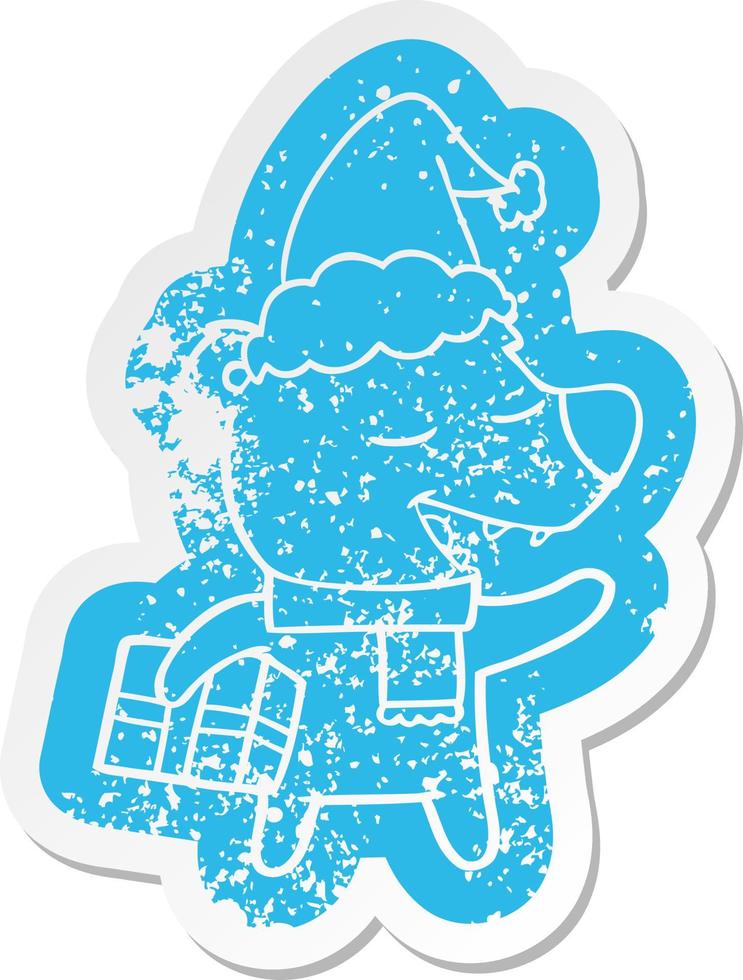 cartoon distressed sticker of a bear with present wearing santa hat vector