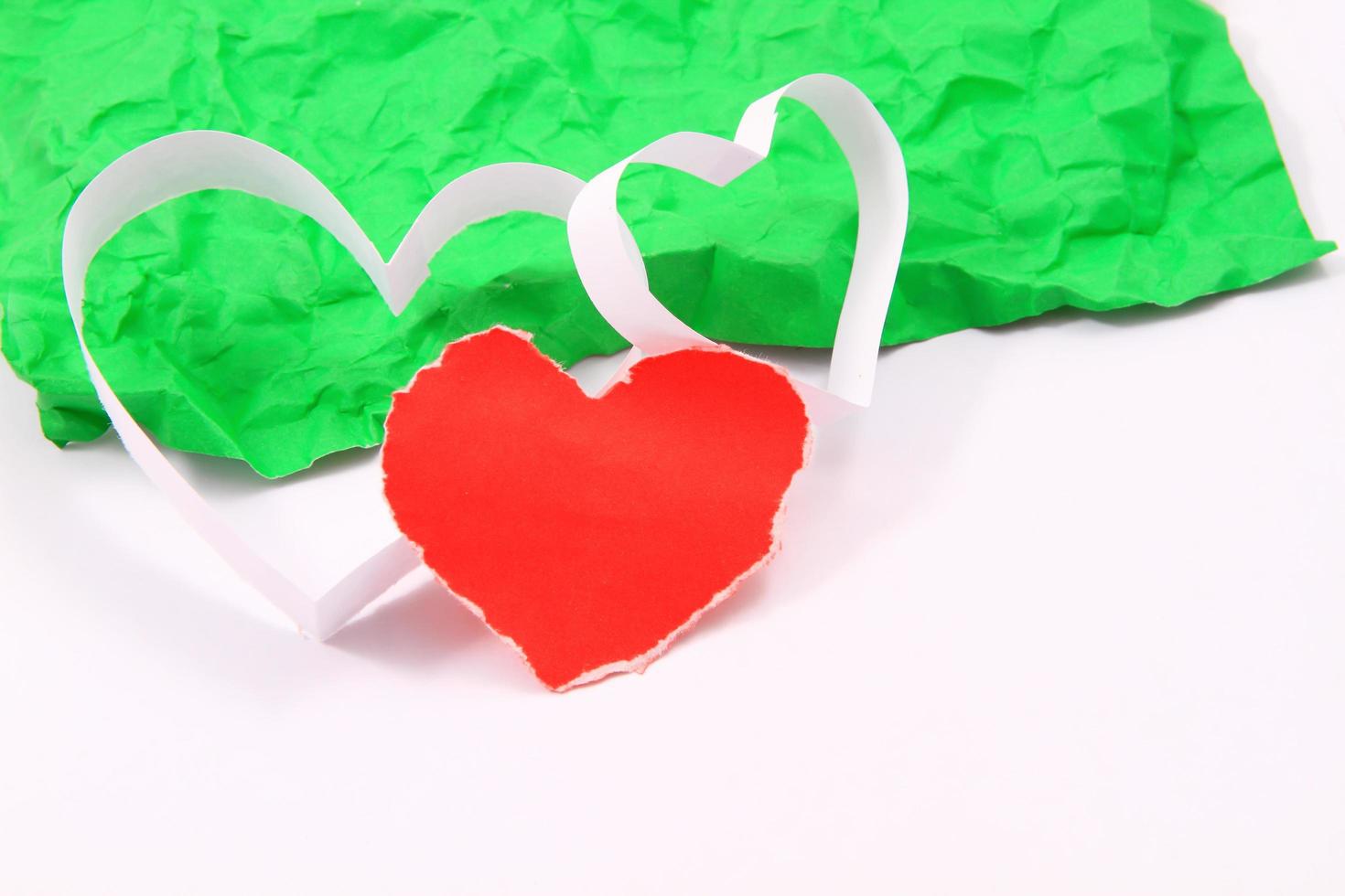 Paper hearts on white background photo