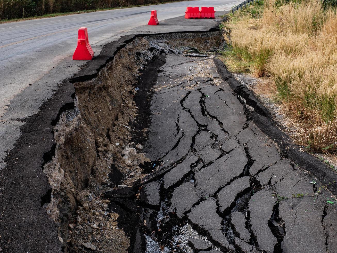 Cracked surface of an asphalt road photo
