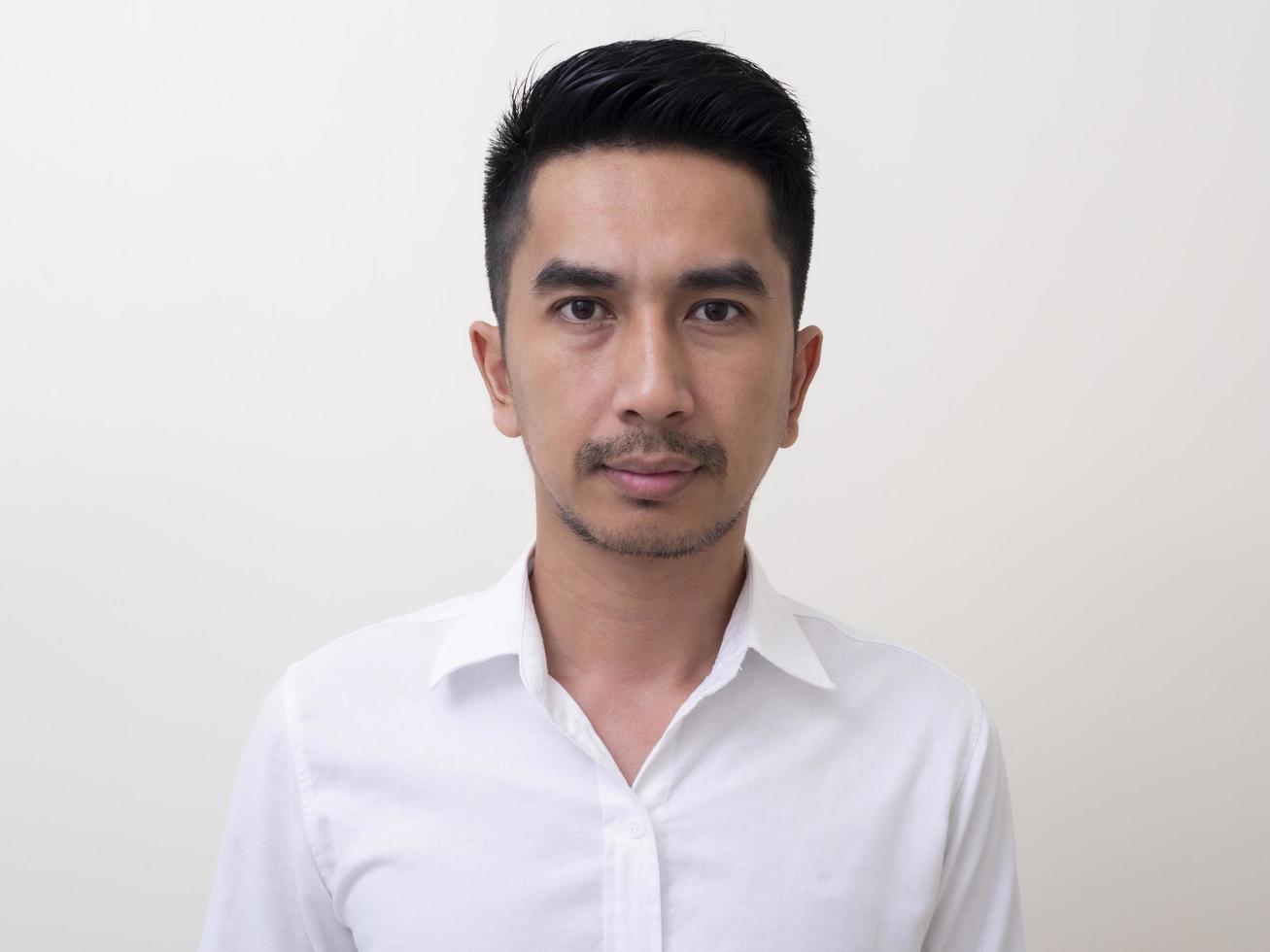 Portrait of smiling young man wearing white  shirt photo