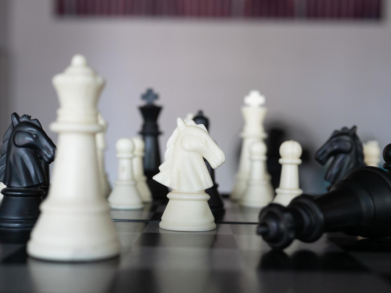 Chess board game with focus on black and white photo