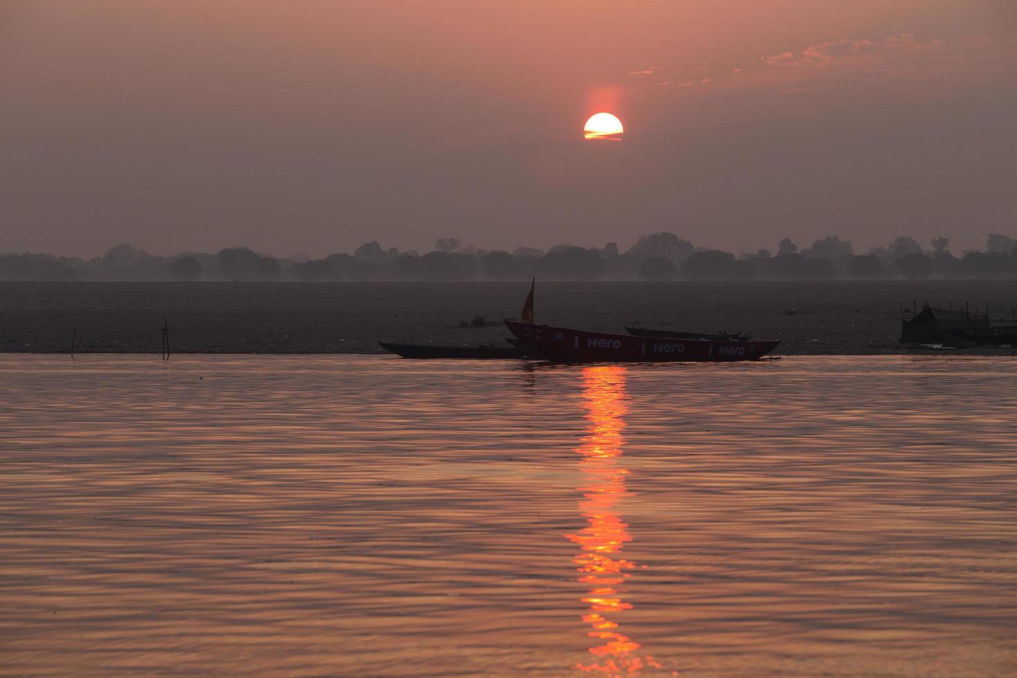 Sunrise on the Ganga river, Varanasi, India photo