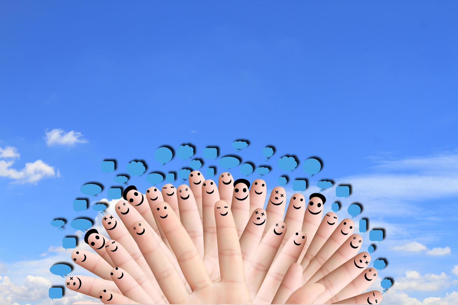 group of finger faces with social chat sign and speech bubbles photo
