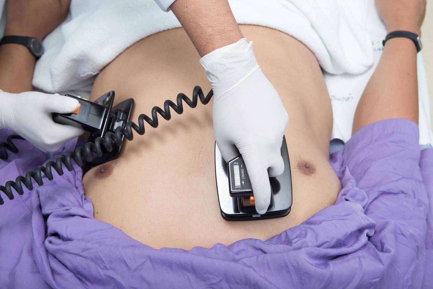 Defibrillator practice on a CPR photo