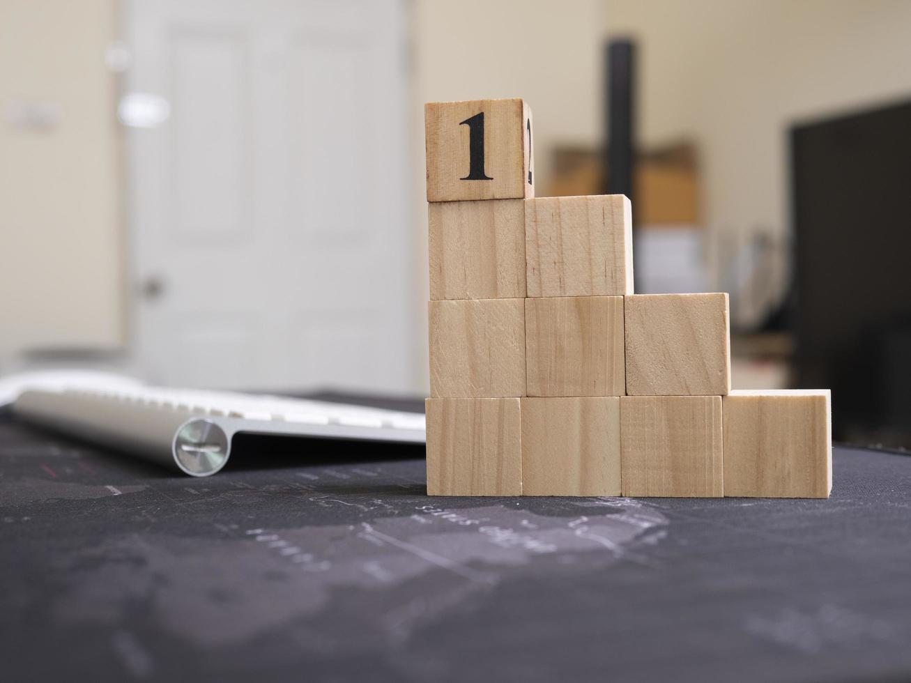 wood cube arrange in pyramid shape ,business concept photo