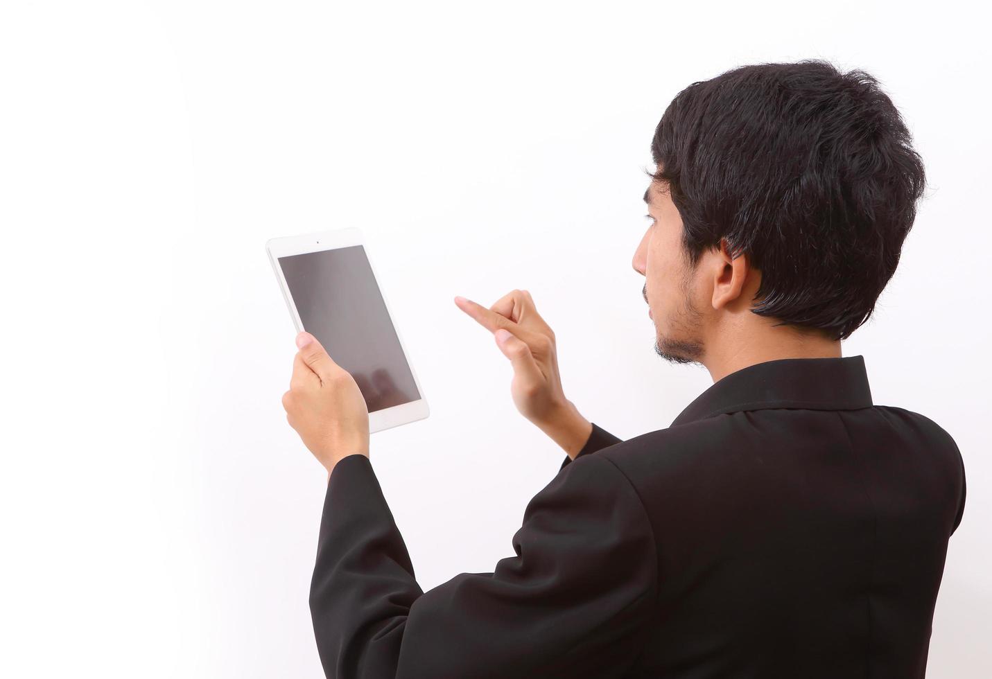 Happy man using digital tablet photo