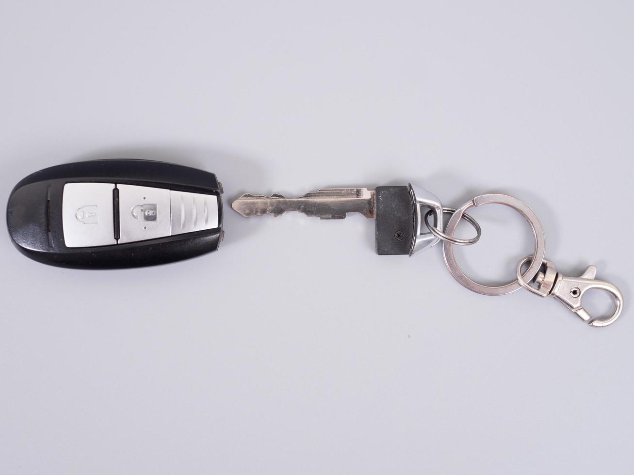 Car key with remote control isolated on gray background. photo