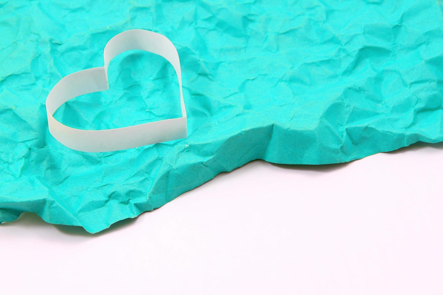 Paper hearts on green background photo