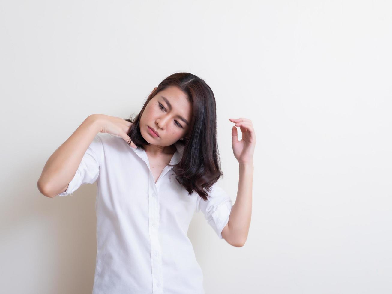 Portrait of young asian woman standing and smiling photo