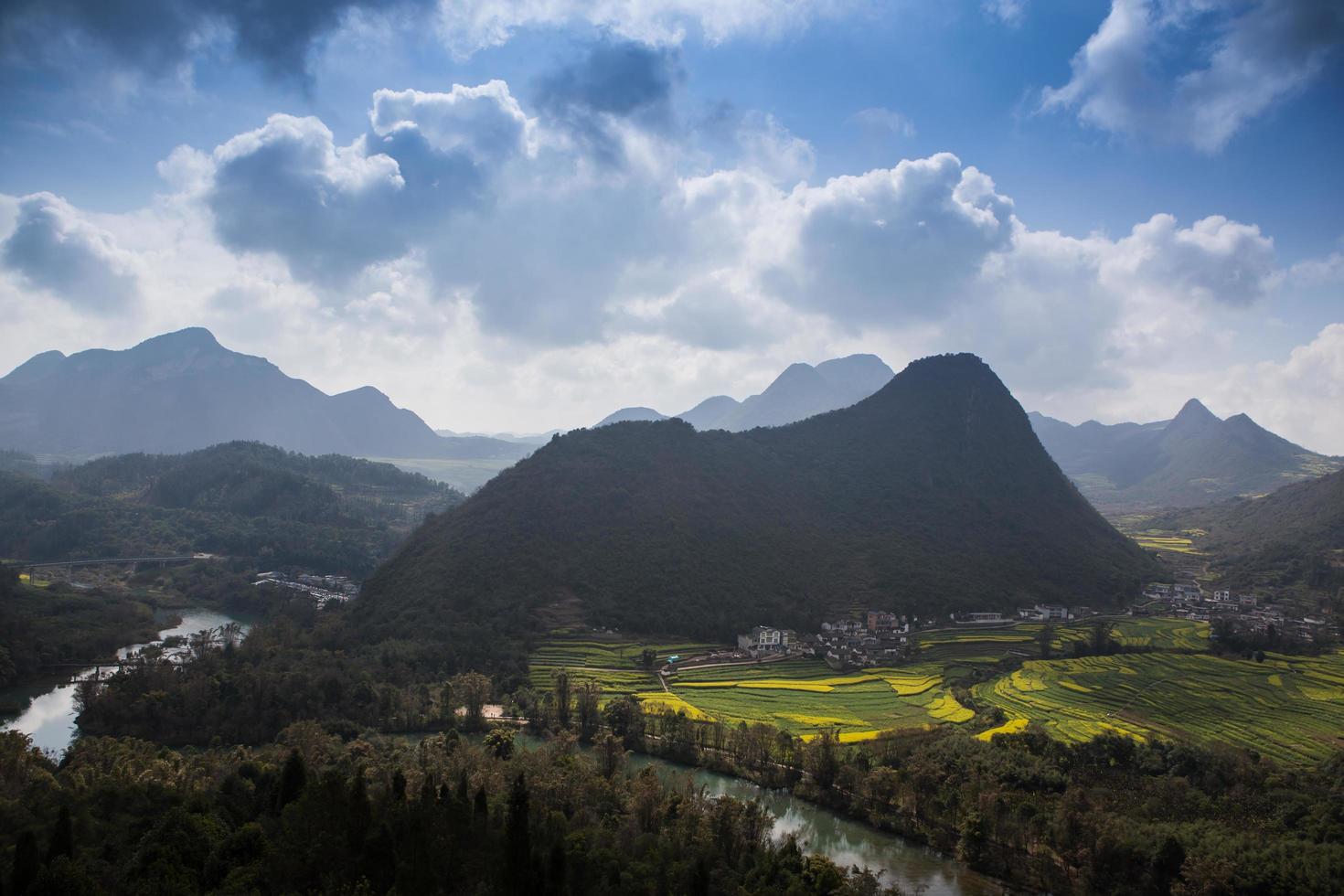 Spring fresh landscape of colorful fields, sunrise sky and beautiful hills valley photo