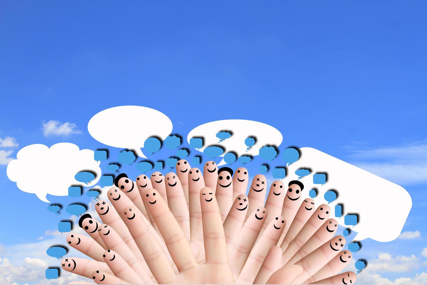 group of finger faces with social chat sign and speech bubbles photo