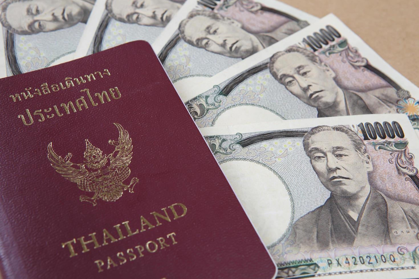 Thailand passport and Japanese Yen money photo