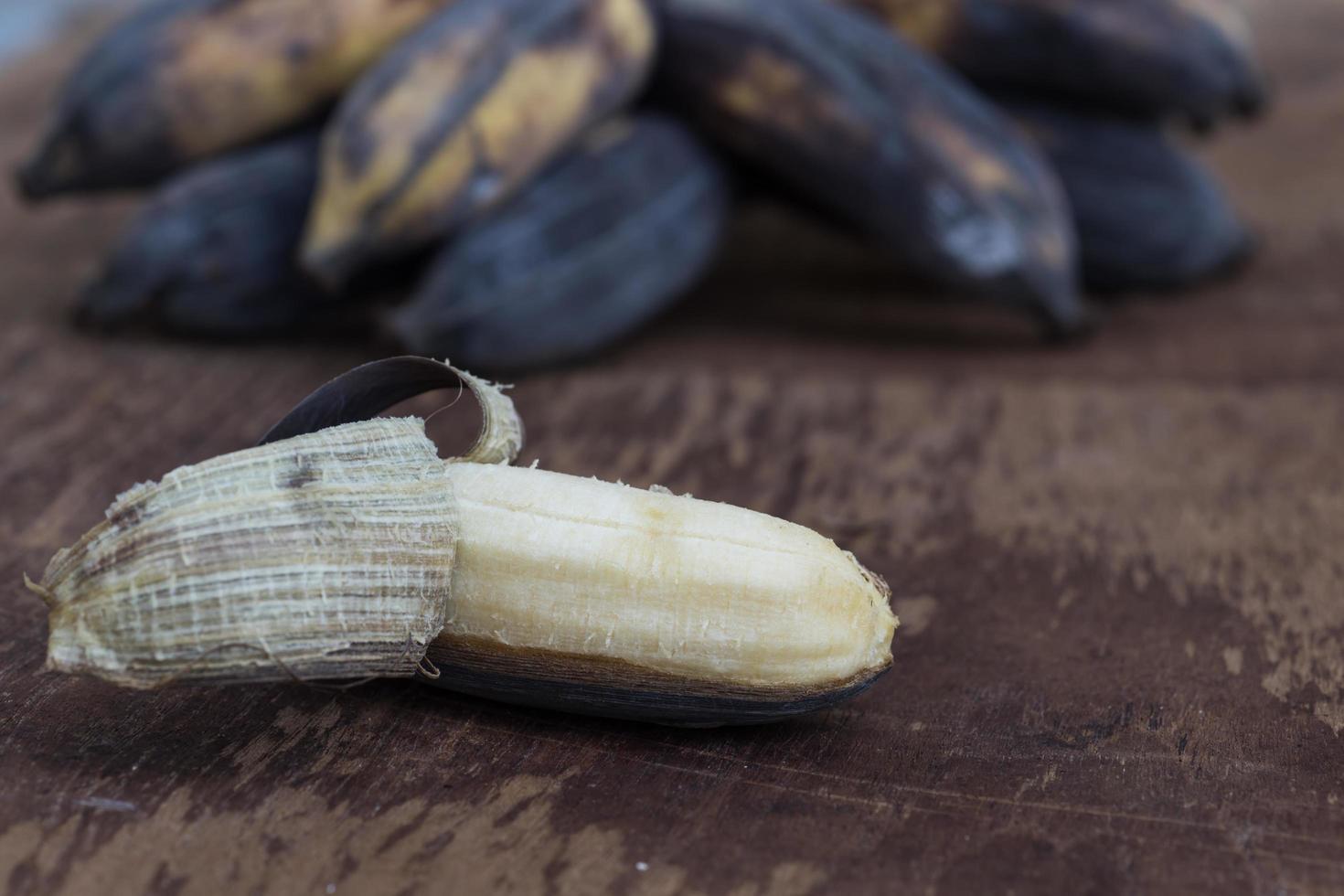 Old banana on a wooden table photo