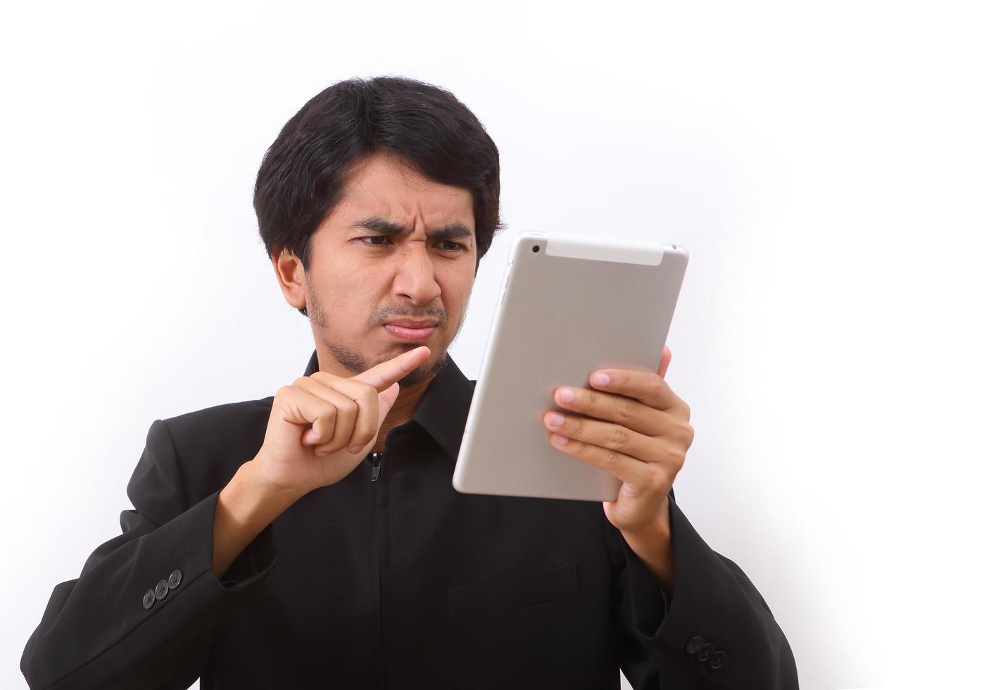 Happy man using digital tablet photo