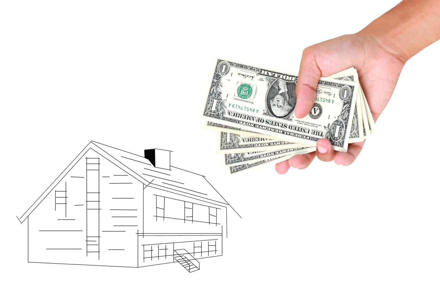 Hands with money and miniature house on a white background photo