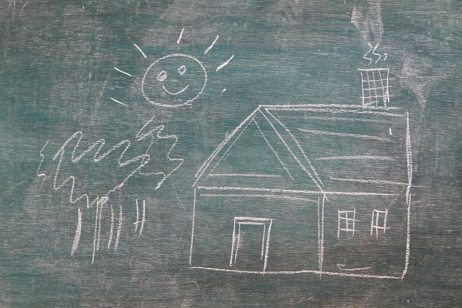 House under the sun drawn in chalk on a blackboard photo