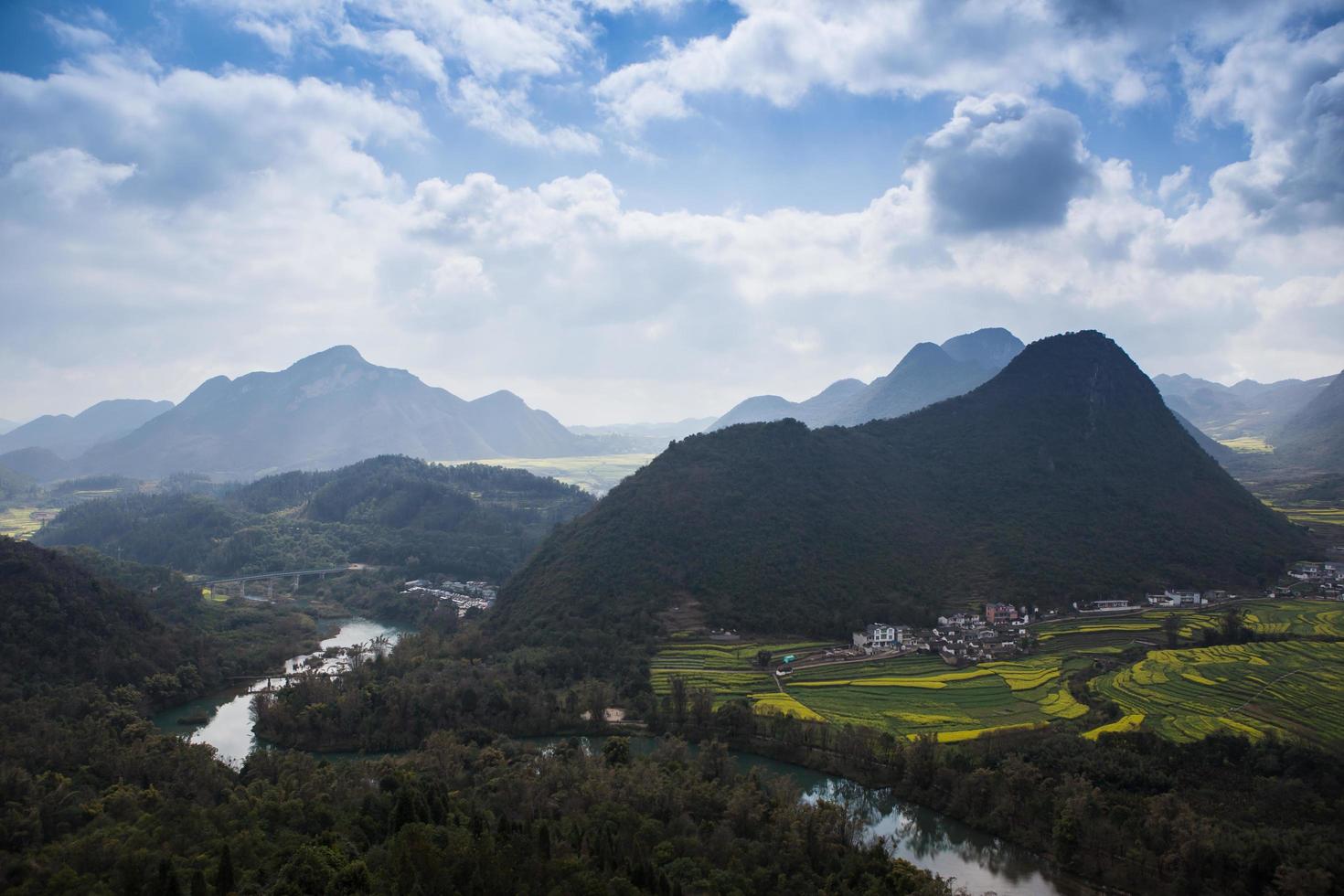 Spring fresh landscape of colorful fields, sunrise sky and beautiful hills valley photo