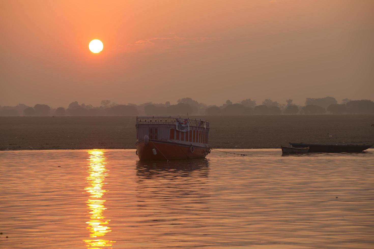 Sunrise on the Ganga river, Varanasi, India photo