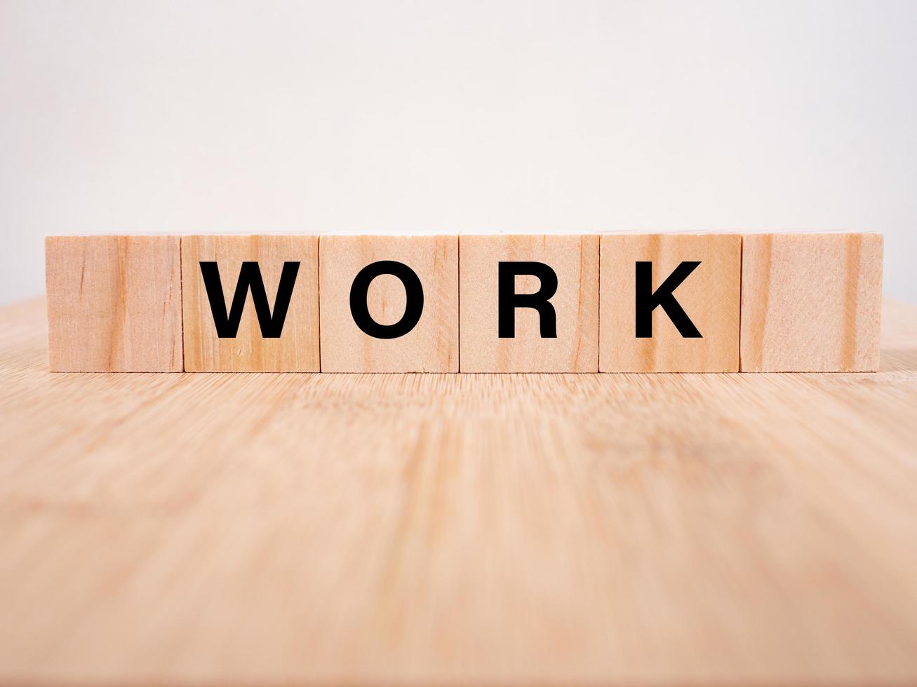 Work word written on wooden cubes photo