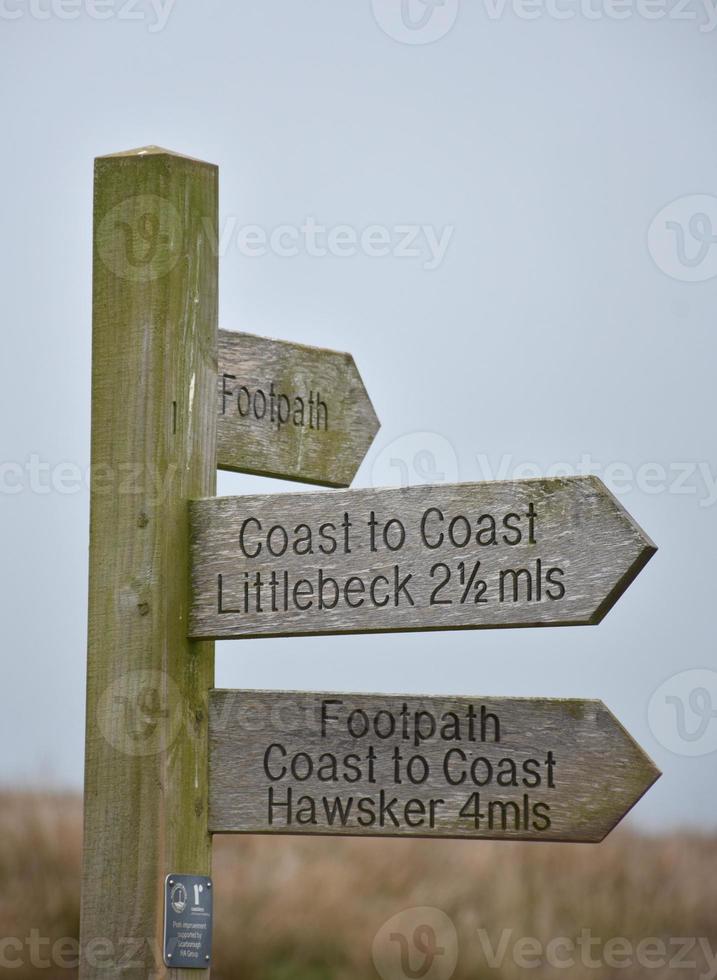 Wood Way Marker Along Coast to Coast Showing Distances photo