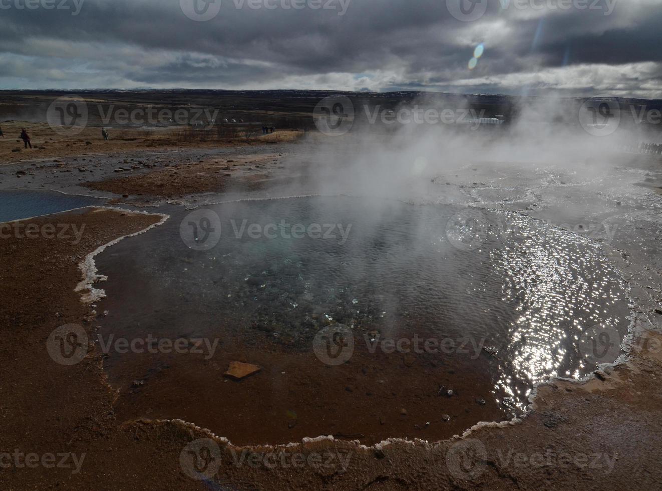 Icelandic geysir in a scenic view of the landscape photo