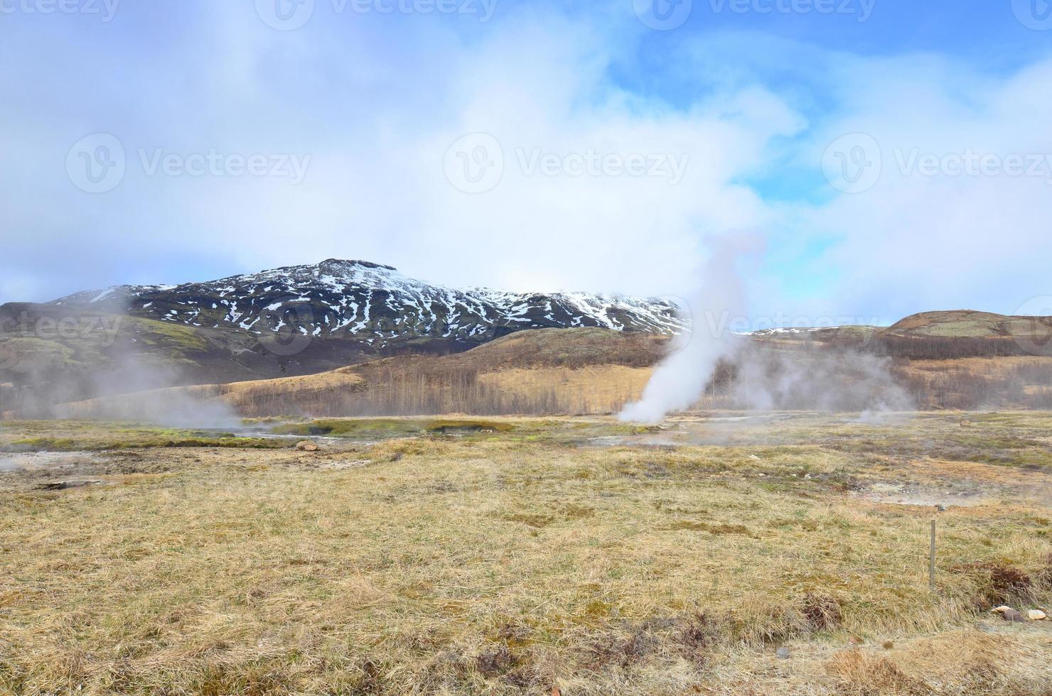 Pretty landscape of steaming geysers in Iceland photo