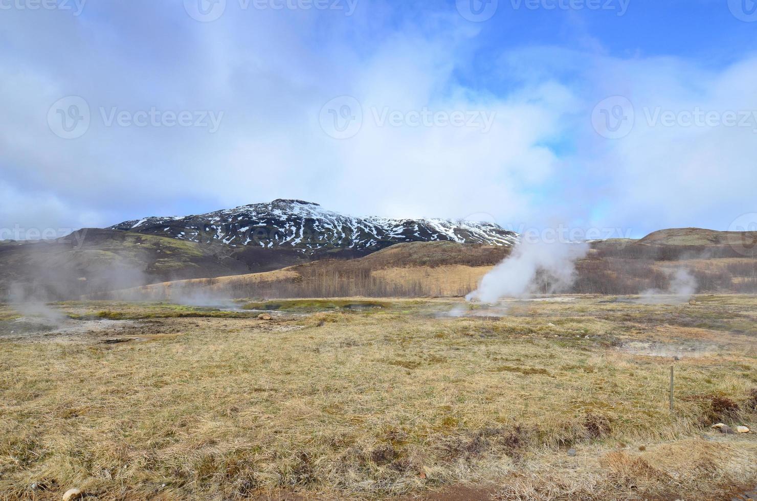 Stunning landscape of an Icelandic steaming geyser photo