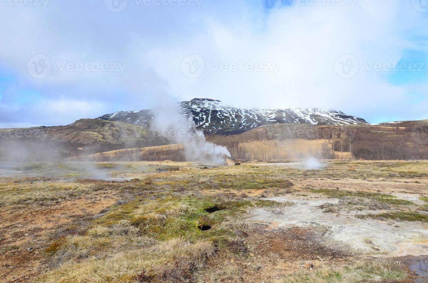 A field in Iceland with a scenic view of the geysirs photo