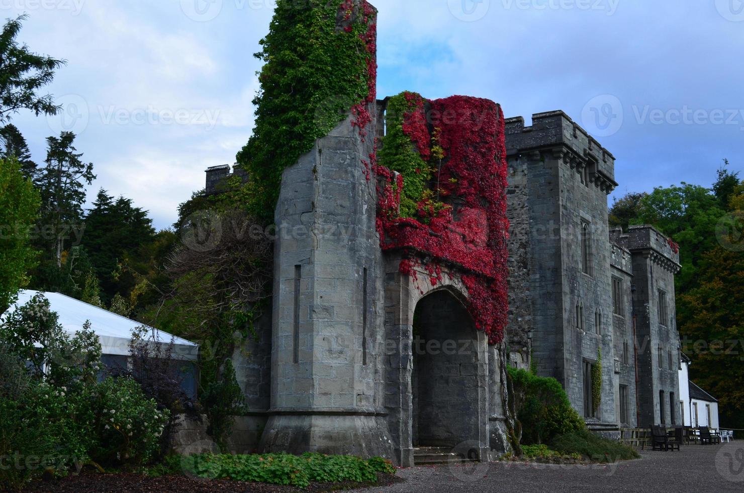 Scottish castle with beautiful vegetation surrounding the ruins photo