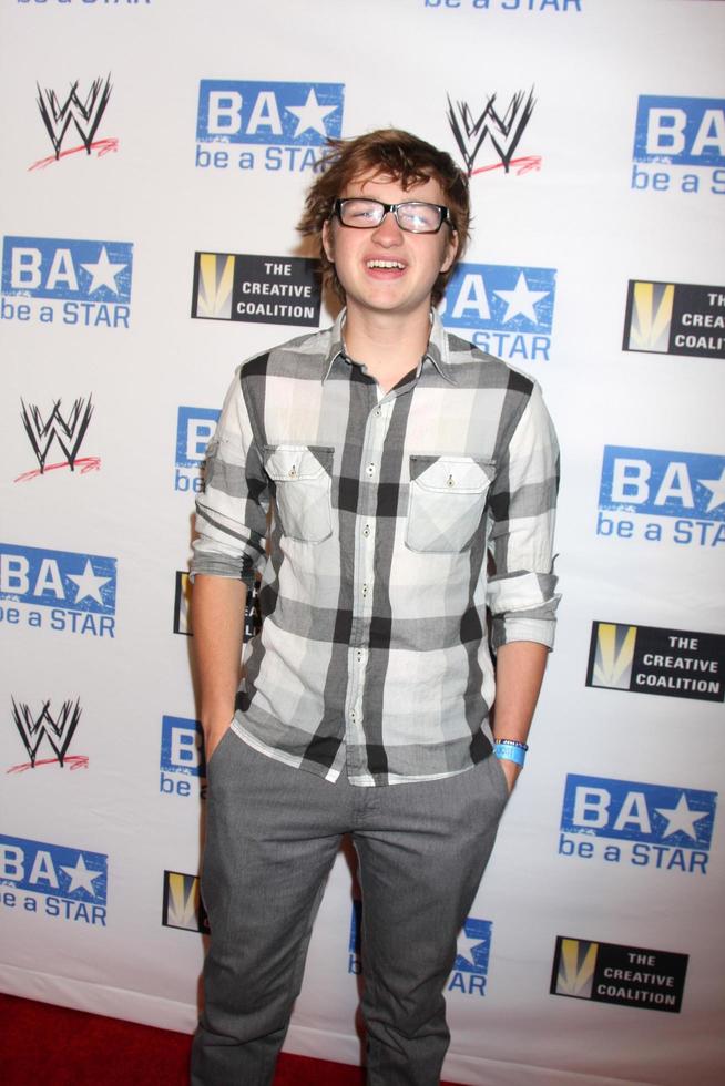 LOS ANGELES, AUG 11 - Angus T. Jones arriving at the be A STAR Summer Event at Andaz Hotel on August 11, 2011 in Los Angeles, CA photo