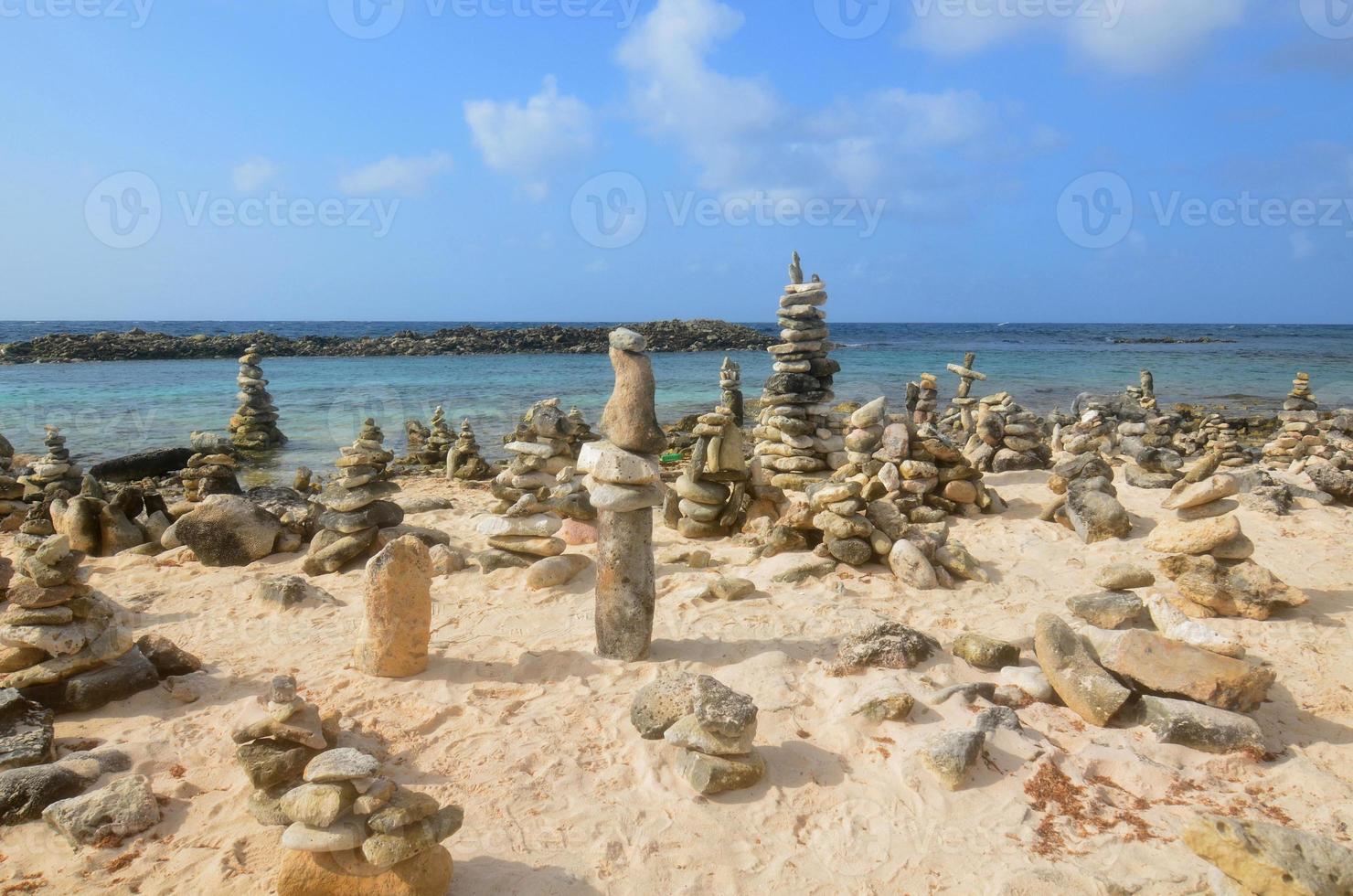 Stone Cairns on Baby Beach In Aruba photo