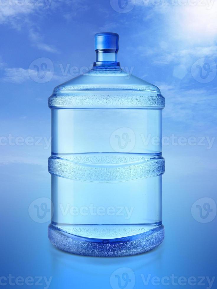 A large bottle of pure with Blue Sky Background photo