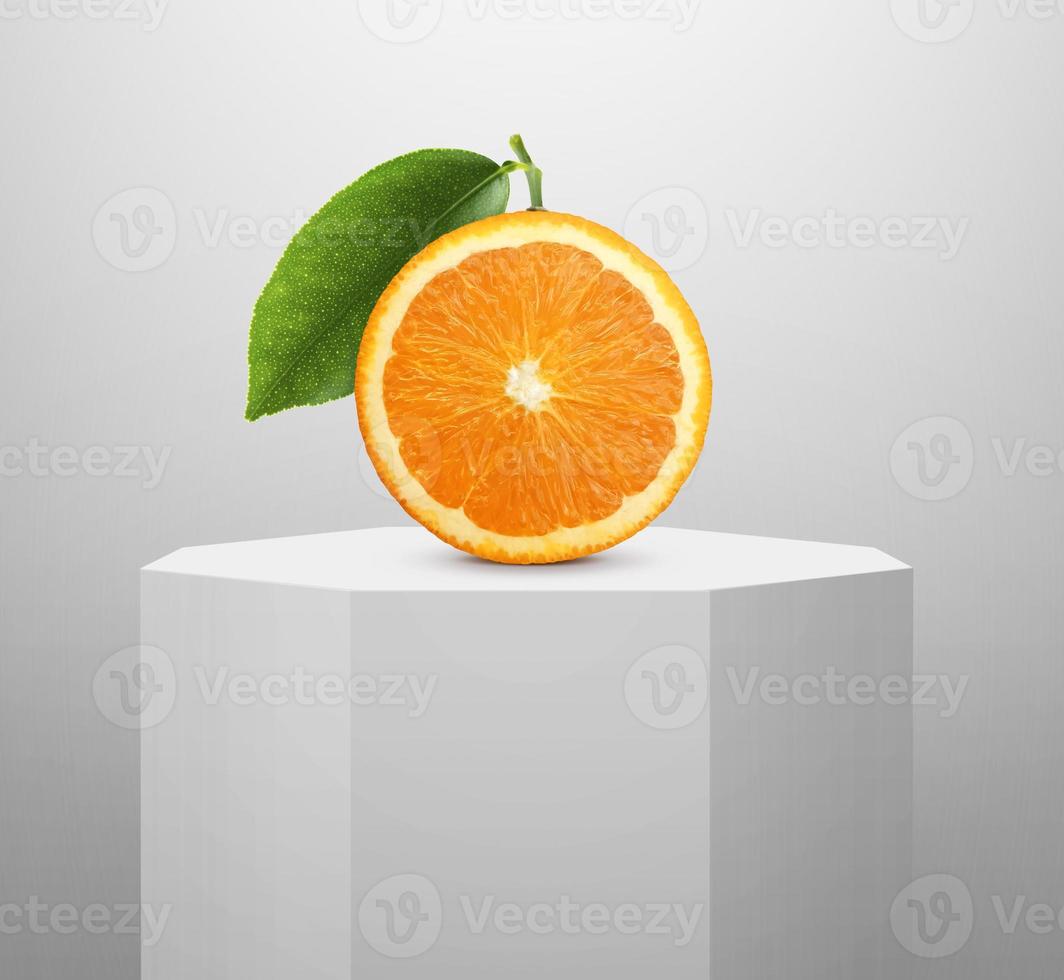 orange slice, on Shiny white round pedestal podium photo