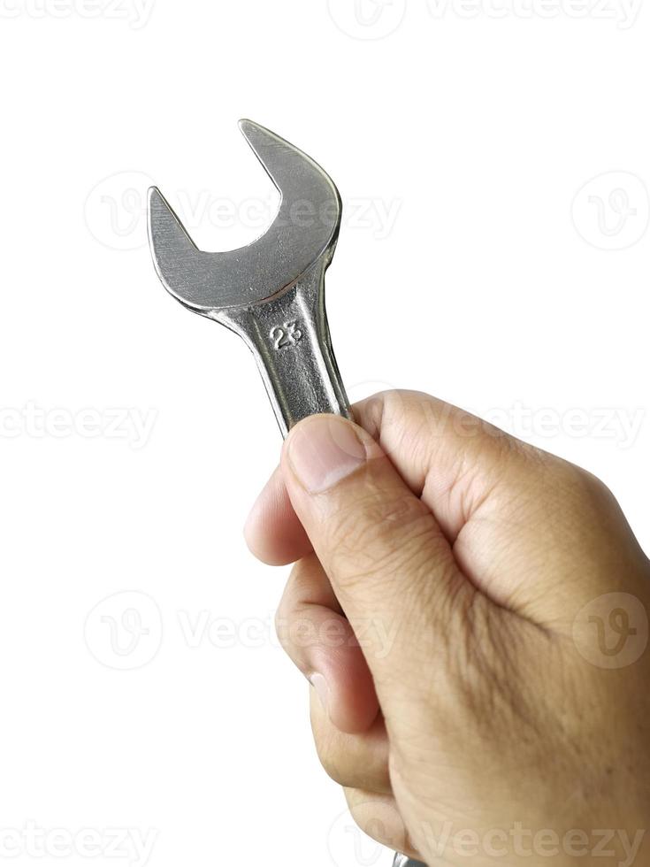 Wrench and hand with white background. Craftsman tool photo