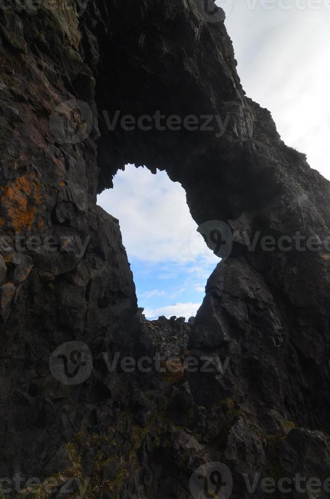 Window Through a Rock Formation in Iceland photo