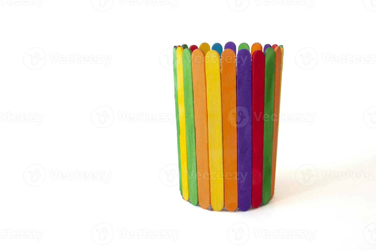 Invention of toys from colorful popsicle sticks isolated on white background. photo
