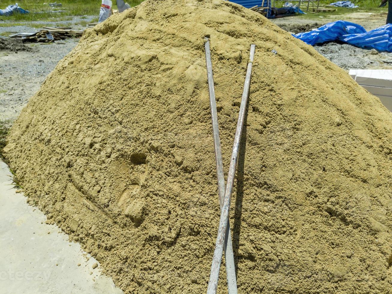 pile of sand material for construction work photo