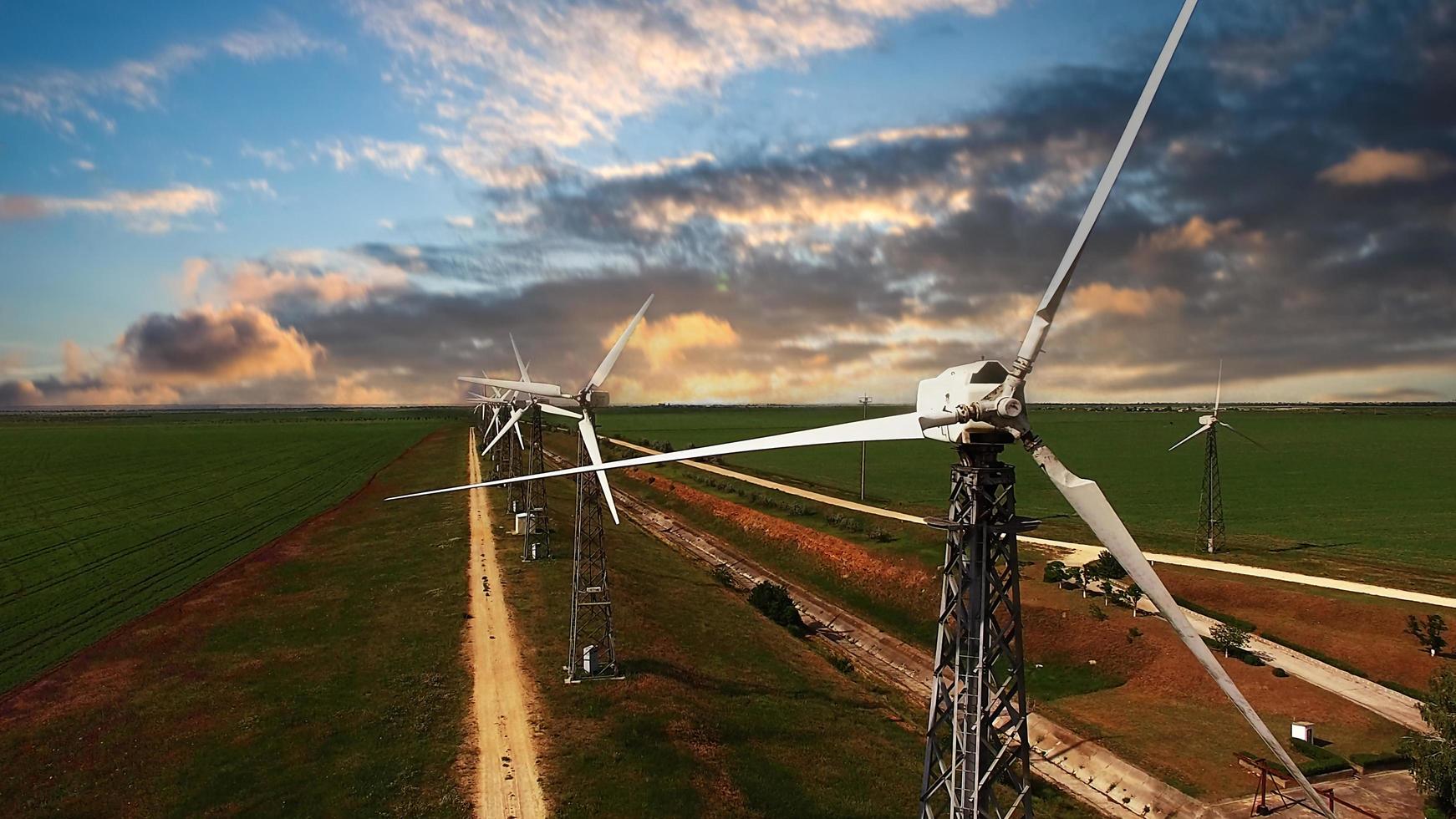 Aerial view of the field with windmills. photo