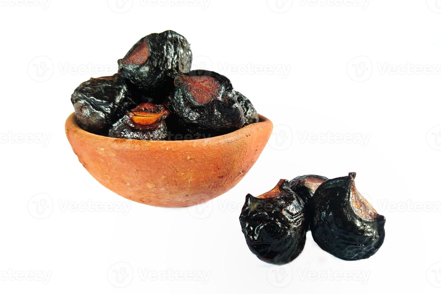 Selected focus photo, soapnut or sapindus rarak, also known as sapindus mukorossi, natural detergent, isolated on a white background. photo
