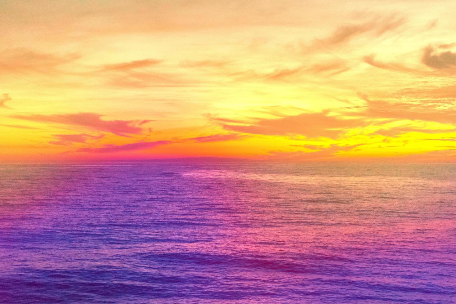 Fantastic landscape with pink sea under a yellow sky photo